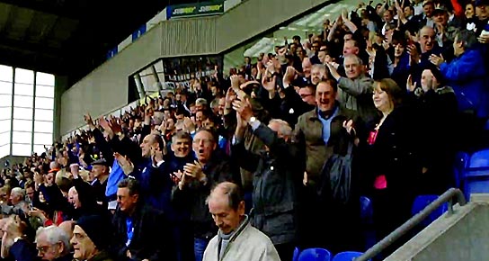 Wigan fans celebrate beating Arsenal
